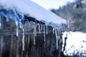 snow and ice on roof gutters